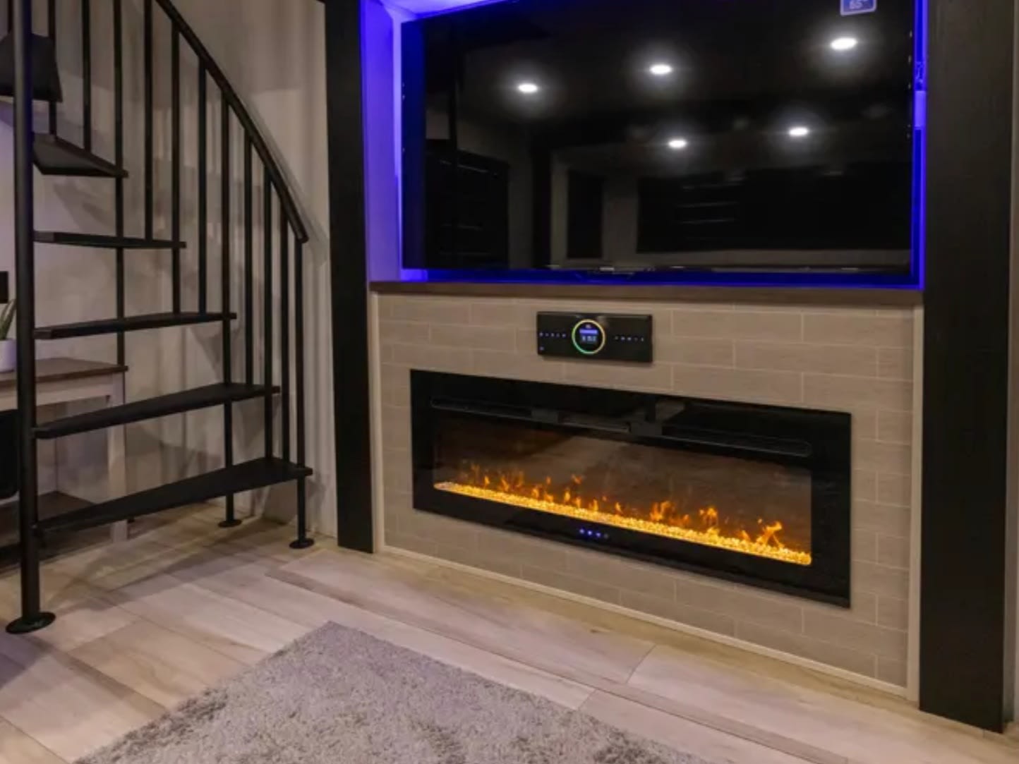 Electric fireplace below a wall-mounted TV
