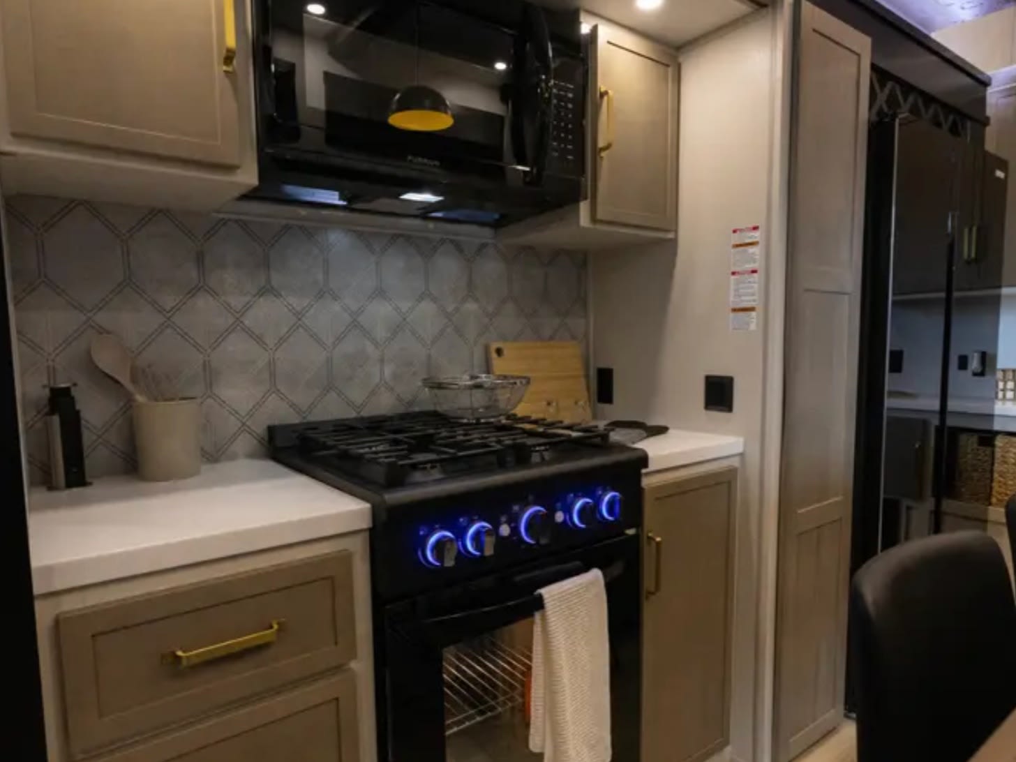 Residential gas range, microwave and tile backsplash