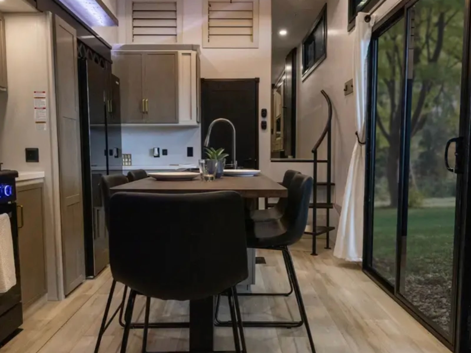 Kitchen island and dining area with sliding glass doors