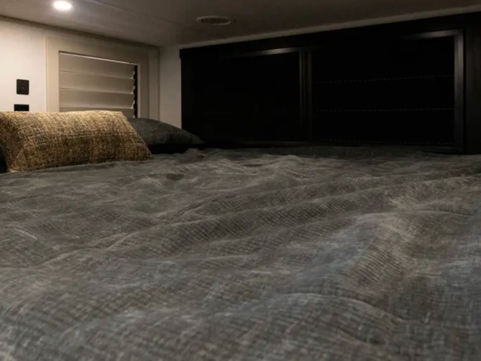 Made bed in the second sleeping area