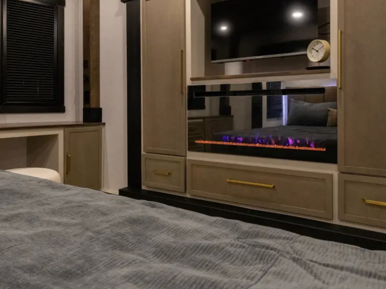 Master suite with electric fireplace and TV
