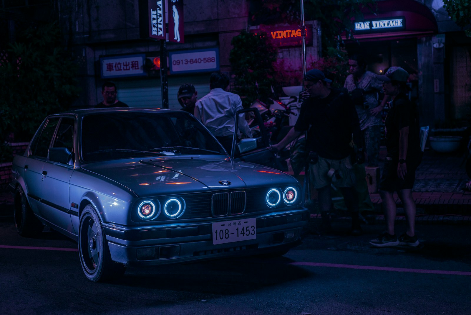 Cars lined up at a car meet